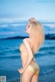 Atittaya Chaiyasing beauty poses hot on the beach with a yellow bikini (41 photos)
